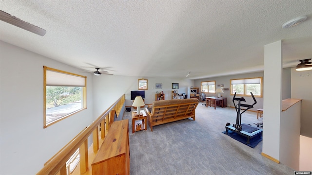 interior space with a textured ceiling and baseboards