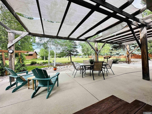 view of patio with outdoor dining area and a pergola