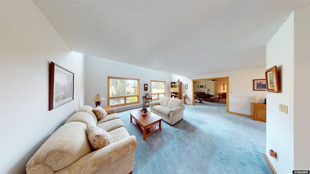 carpeted living area featuring a textured ceiling and baseboards