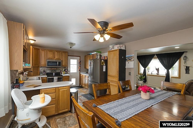 dining space with a ceiling fan