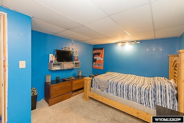 bedroom with carpet and a drop ceiling