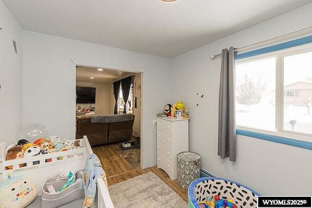 bedroom with wood finished floors