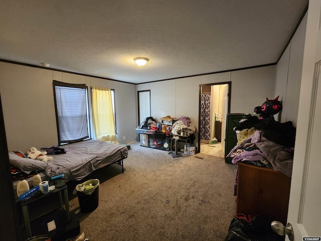 carpeted bedroom featuring a textured ceiling and crown molding