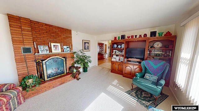 living area featuring visible vents, a fireplace, and carpet