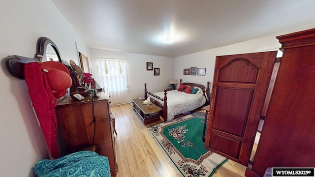 bedroom featuring light wood-style floors