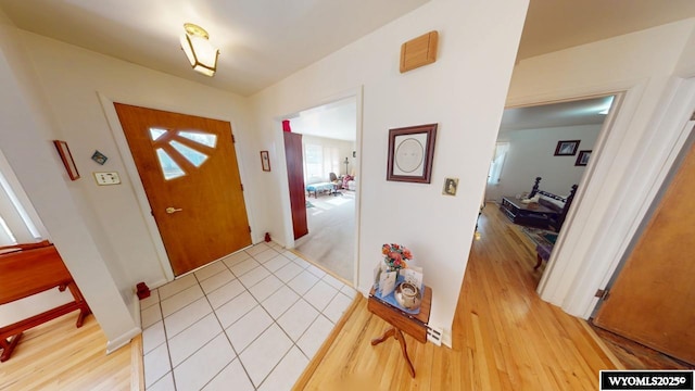 foyer entrance featuring light wood-style flooring