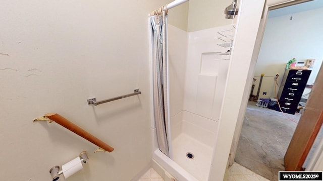 full bath with a shower stall