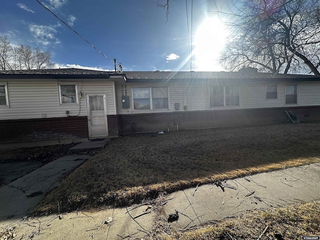 back of property with brick siding