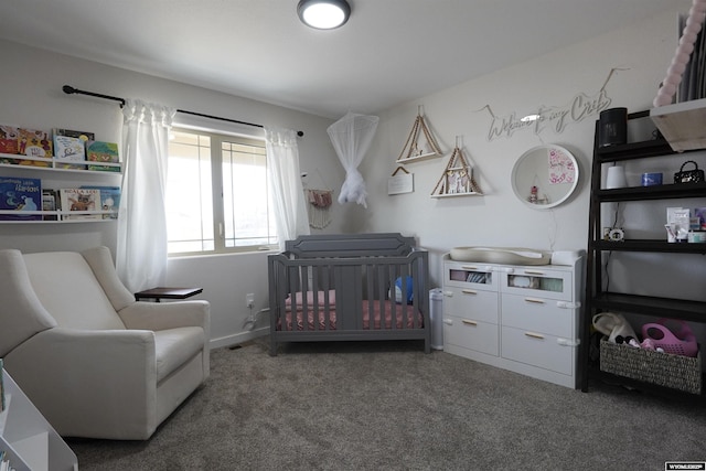 carpeted bedroom featuring a crib