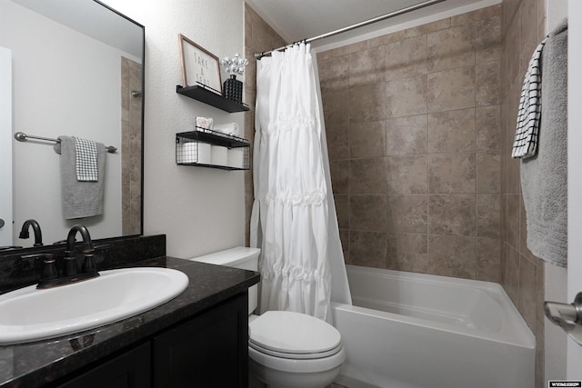 full bathroom featuring shower / tub combo, vanity, and toilet