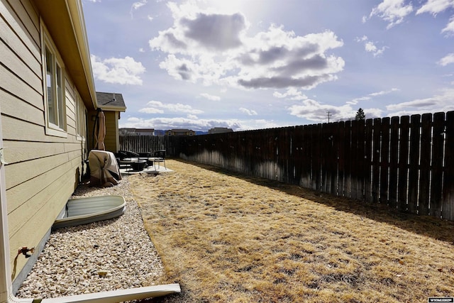 view of yard featuring a fenced backyard and a patio