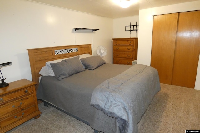 carpeted bedroom featuring a closet