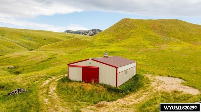 view of pole building with a mountain view