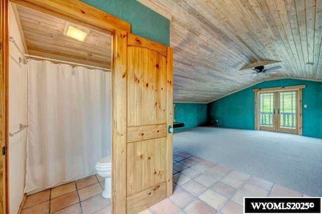 bonus room with lofted ceiling, wood ceiling, carpet floors, and tile patterned flooring