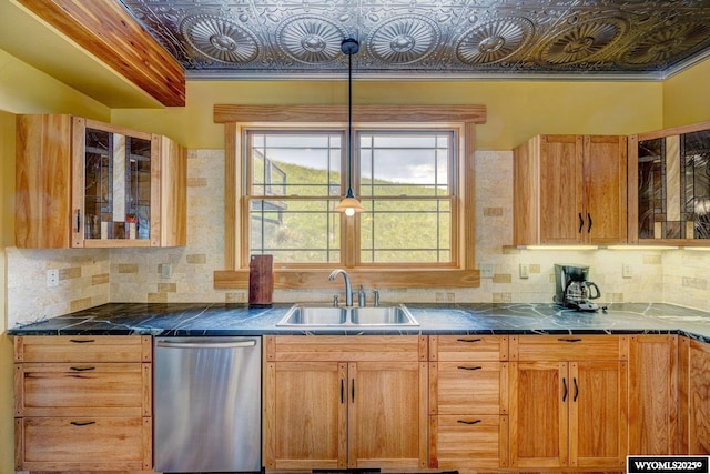 kitchen featuring a sink, an ornate ceiling, tasteful backsplash, and stainless steel dishwasher