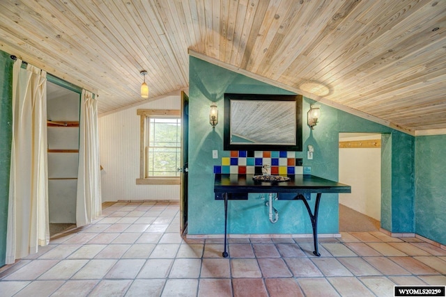 interior space with lofted ceiling and wooden ceiling