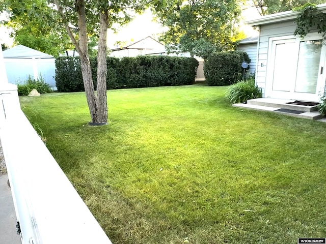 view of yard with fence