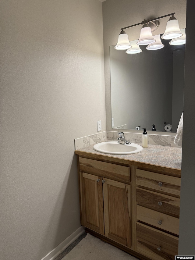 bathroom featuring vanity and baseboards