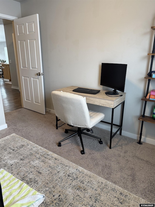 carpeted office with baseboards