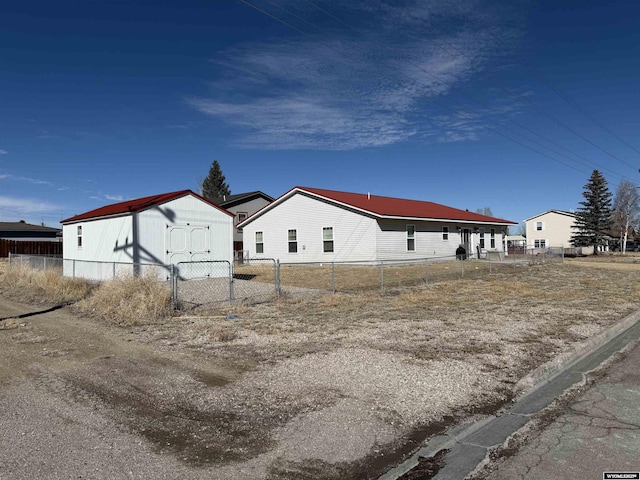 view of side of home with fence