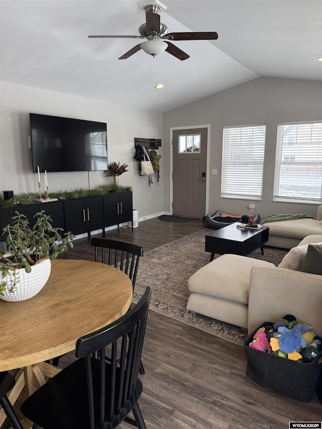 living area with lofted ceiling, a ceiling fan, and wood finished floors