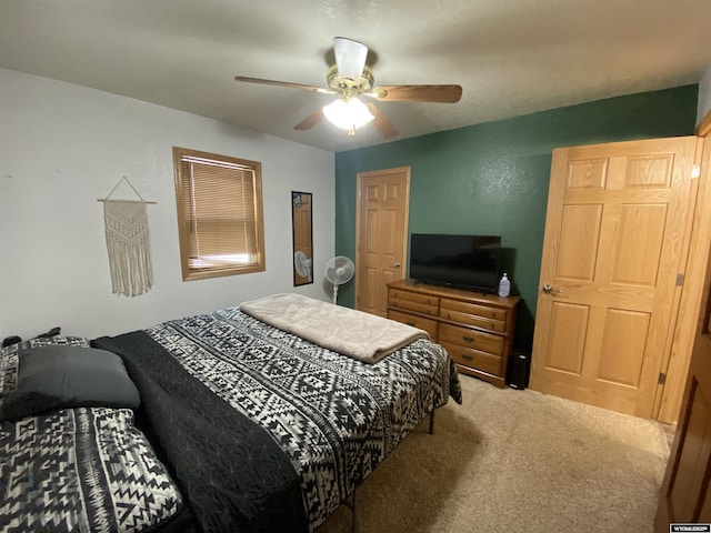 bedroom featuring a ceiling fan and carpet flooring