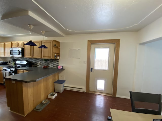 kitchen featuring a baseboard heating unit, a peninsula, appliances with stainless steel finishes, decorative backsplash, and dark wood finished floors