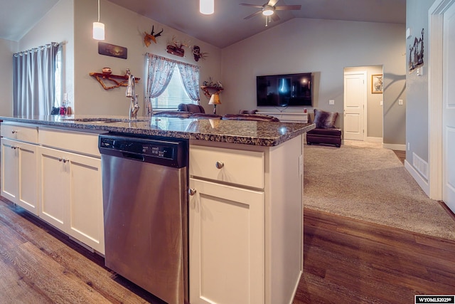 kitchen featuring lofted ceiling, stainless steel dishwasher, open floor plan, white cabinetry, and ceiling fan