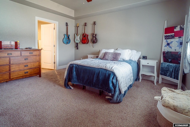 bedroom featuring light carpet, ceiling fan, and baseboards