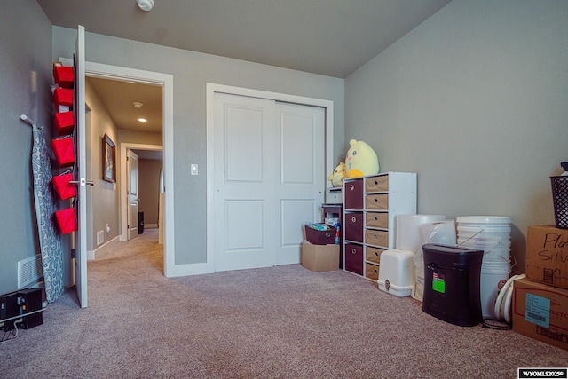 interior space featuring a closet, carpet, visible vents, and baseboards