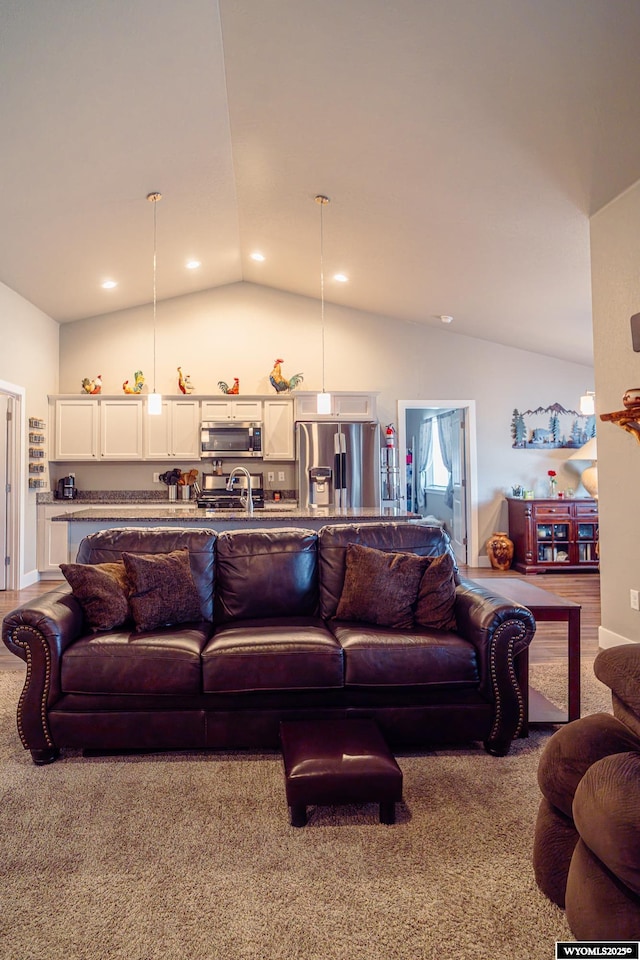 living room with vaulted ceiling and recessed lighting