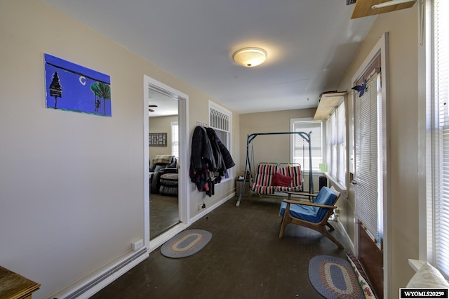 interior space featuring plenty of natural light and baseboards