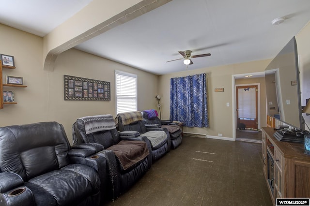 living room with a ceiling fan, dark wood finished floors, and baseboards