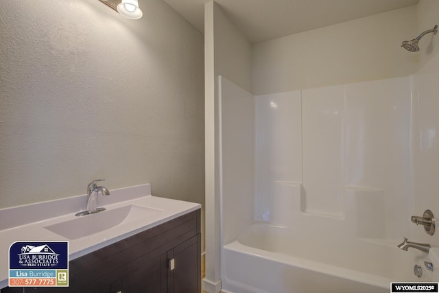 full bathroom featuring shower / bathtub combination and vanity