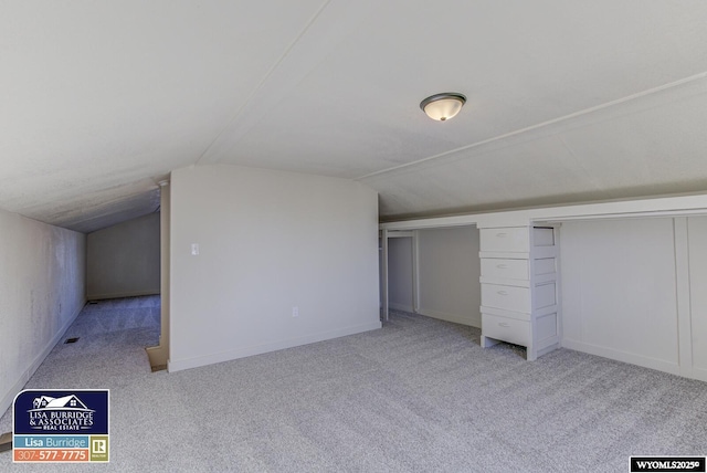 bonus room featuring carpet floors, lofted ceiling, and baseboards