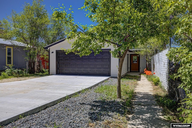 view of front of home with driveway and an attached garage