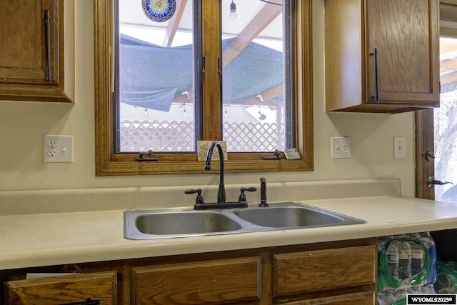 kitchen featuring light countertops and a sink