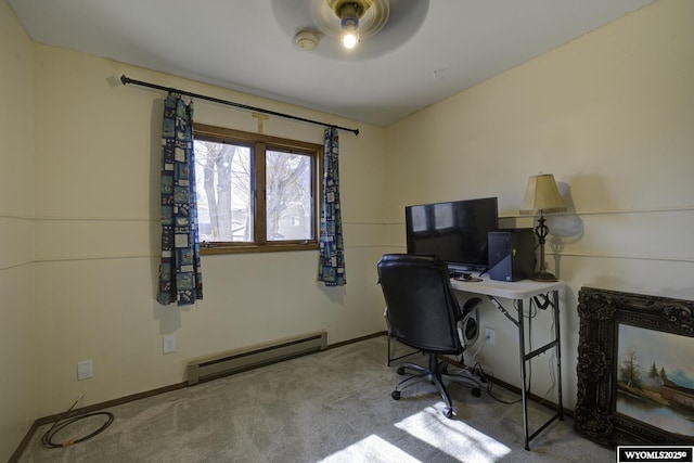 home office featuring a baseboard heating unit, carpet, and baseboards