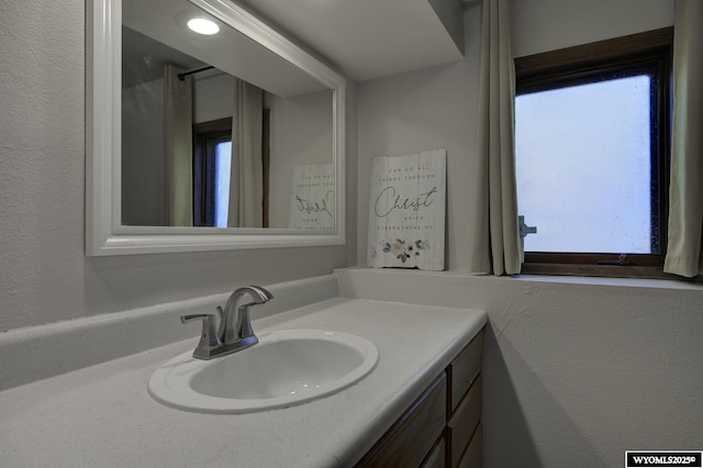 bathroom with a healthy amount of sunlight and vanity