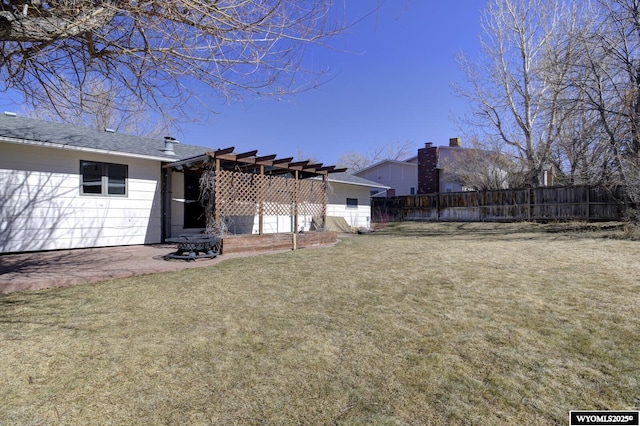 view of yard featuring fence, a patio, and a pergola