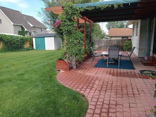 view of patio featuring an outbuilding, fence, and a storage shed