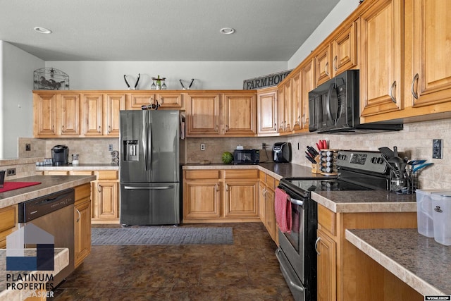 kitchen featuring tasteful backsplash, appliances with stainless steel finishes, and light countertops