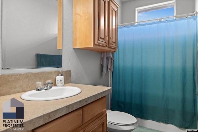 full bath with curtained shower, backsplash, toilet, and vanity