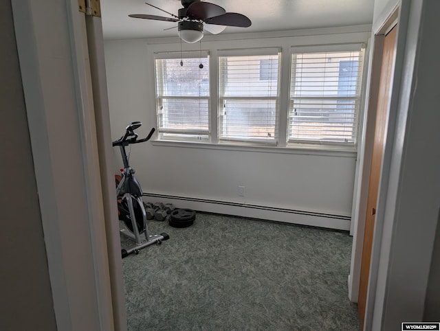 workout area with ceiling fan, a baseboard radiator, and carpet flooring