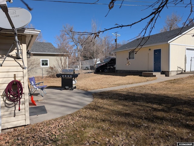 view of yard with fence and a patio