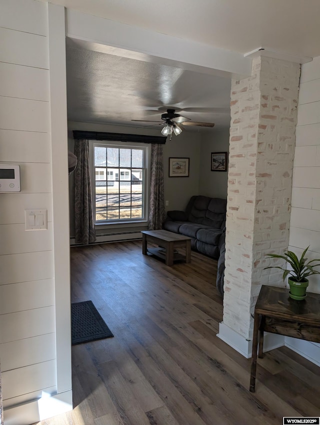 living area featuring ceiling fan and wood finished floors