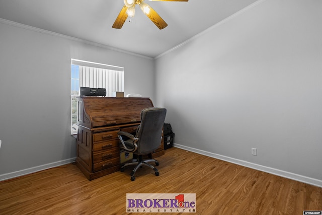 home office with baseboards, crown molding, light wood-style floors, and a ceiling fan