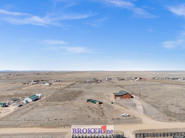 bird's eye view with a rural view and a desert view