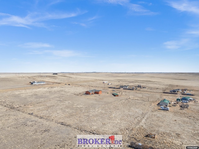 bird's eye view with a rural view and view of desert