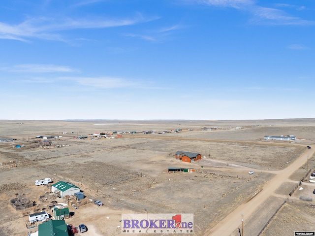 birds eye view of property featuring view of desert